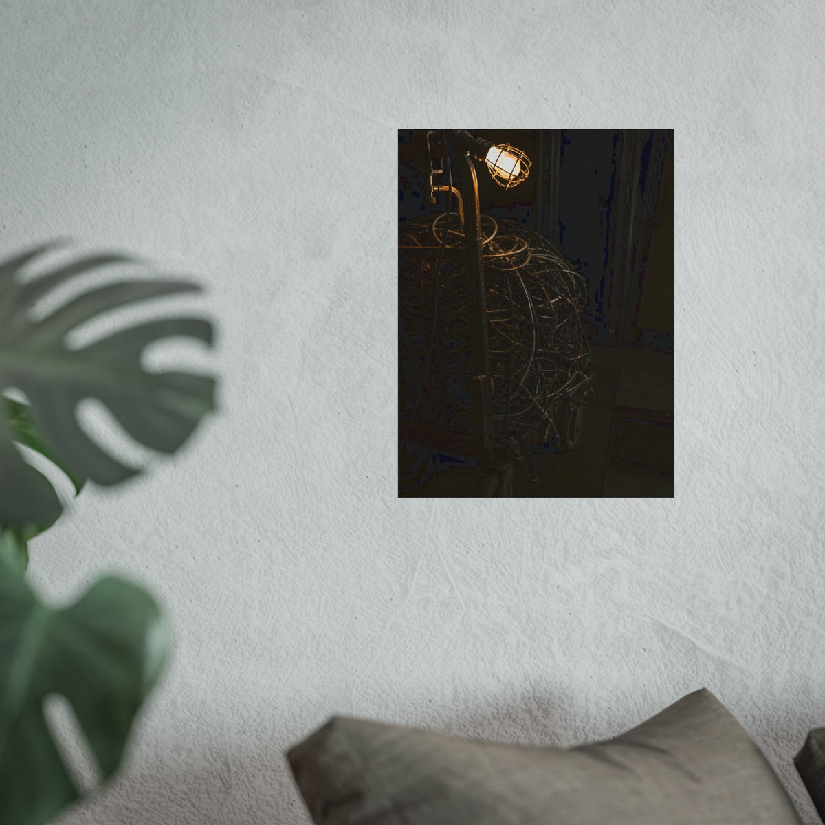 A tangled ball of cables on a hand cart under a caged work lamp. The Cable Harvest by Garabaggio, fine art print hanging in a room.