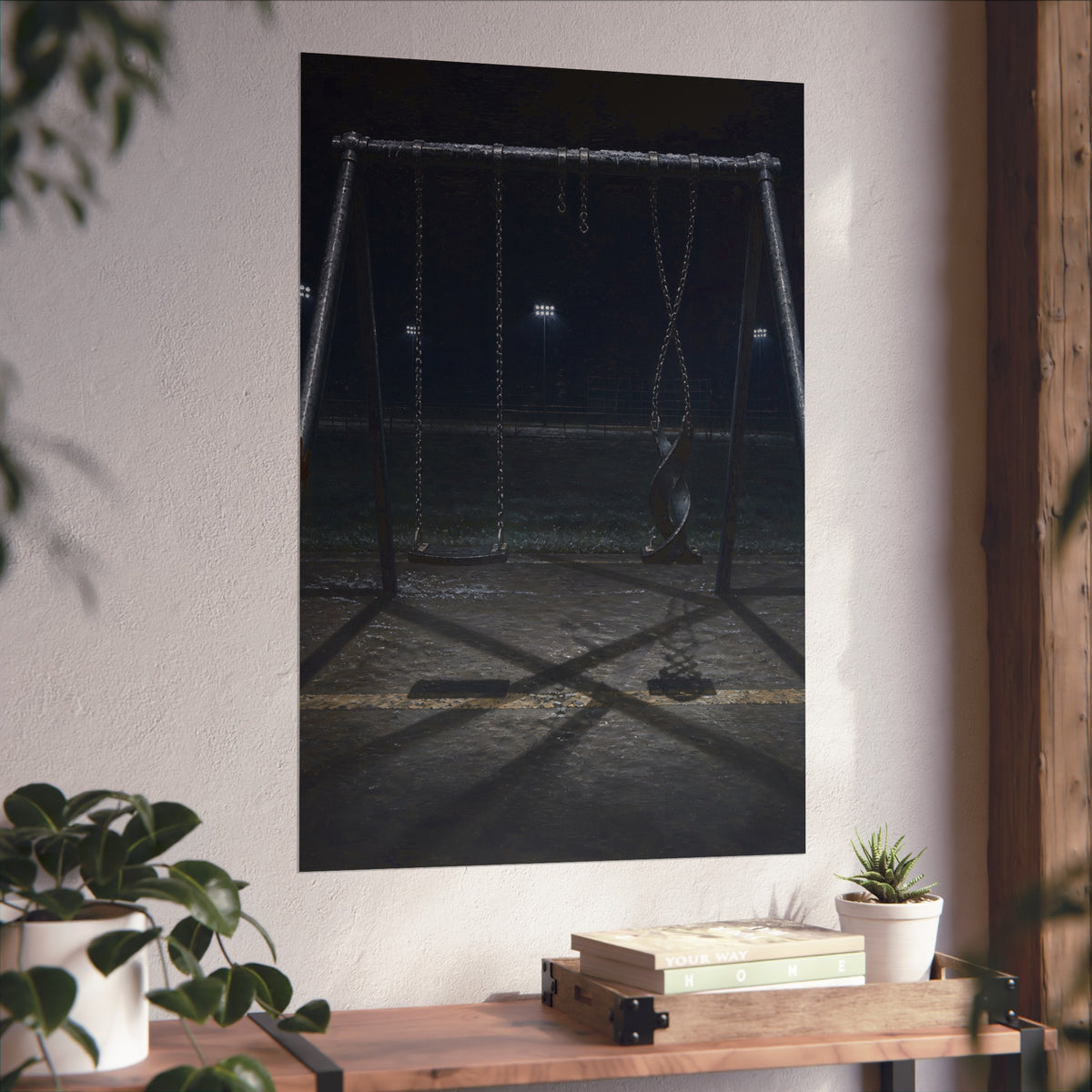 An empty swing set at night with one seat twisted up on its chains. The First Hour: The Twisted Seat by Garabaggio, fine art print hanging in a room.