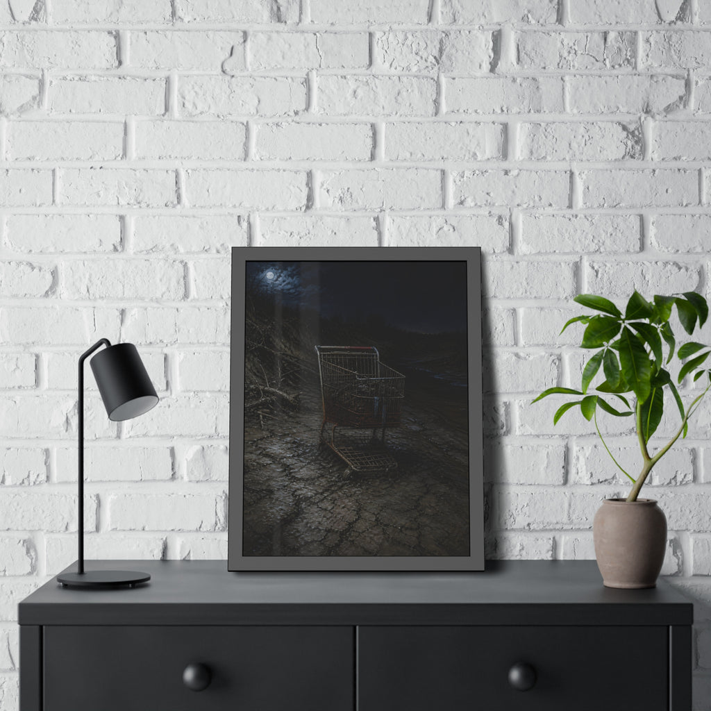 A rusted shopping cart sunk in cracked dried mud under a full moon. The Silting by Garabaggio, framed fine art print hanging in a room.