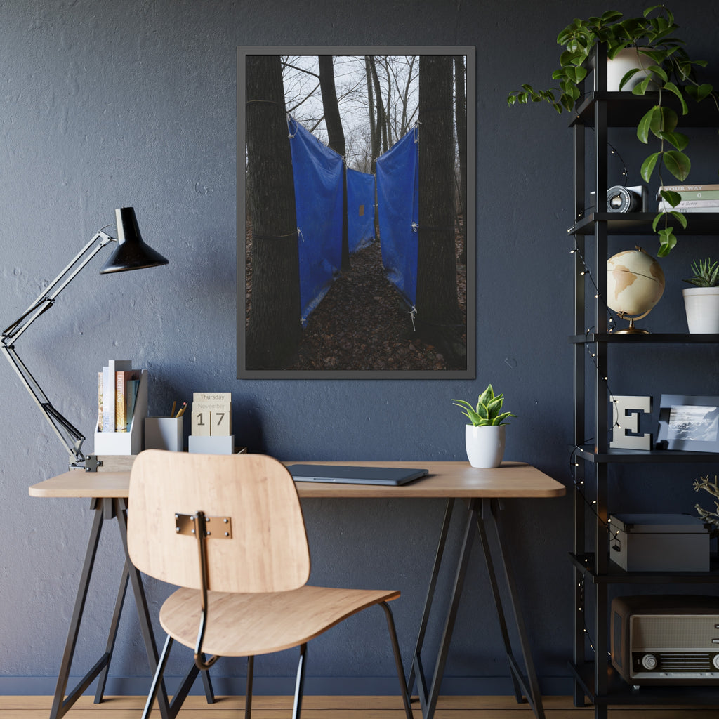 Blue tarps tied between bare trees forming a corridor over dead leaves. Passage Between Trees by Garabaggio, framed fine art print hanging in a room.