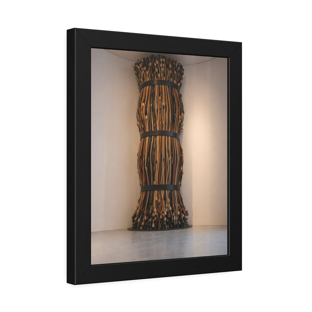 A tall column of bundled cords strapped in three places in a gallery corner. The Bundled Apse by Garabaggio, framed fine art print hanging in a room.