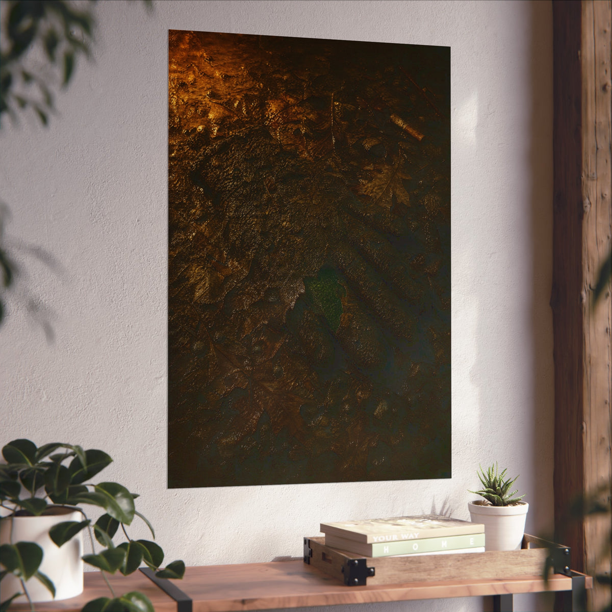 Wet mud and pressed oak leaves with a green scrap barely showing. The Reliquary of Mud and Leaf by Garabaggio, fine art print hanging in a room.