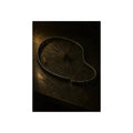 A bent bicycle wheel rim with loose spokes on a dark table in warm light. The Cutting of the Circle by Garabaggio, fine art print, 12″ x 16″.