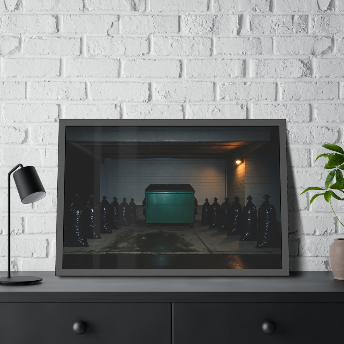 A green dumpster flanked by rows of black garbage bags under a lamp. Night Watch of the Loading Dock by Garabaggio, framed fine art print hanging in a room.