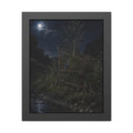 A shopping cart in creekside weeds with a sapling growing up through it. The Cart Grown Through by Garabaggio, framed fine art print, 11″ x 14″.