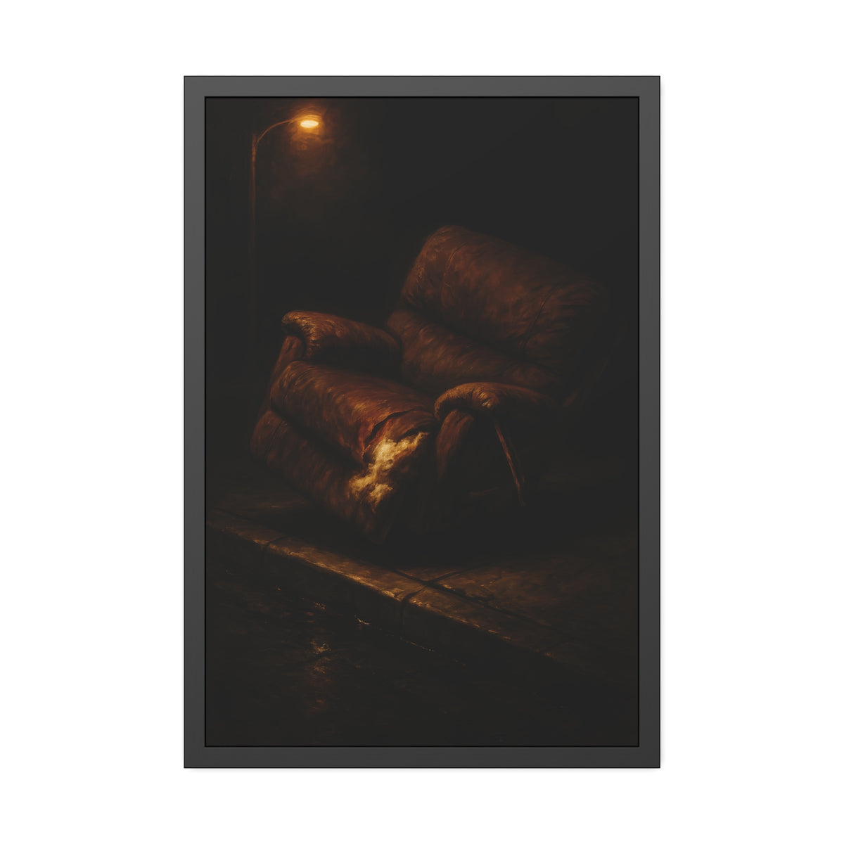 A torn brown recliner tipped on a curb in dim warm light. The Deposition of the Broken Recliner by Garabaggio, framed fine art print hanging in a room.