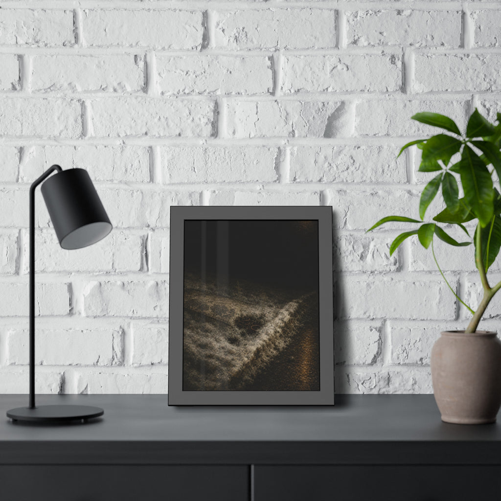 A discarded mattress half buried in snow, a distant streetlight behind. The White Burial by Garabaggio, framed fine art print hanging in a room.