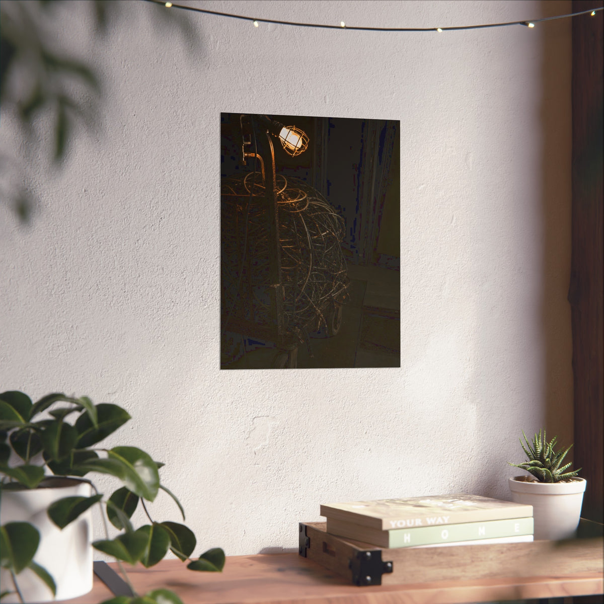 A tangled ball of cables on a hand cart under a caged work lamp. The Cable Harvest by Garabaggio, fine art print hanging in a room.