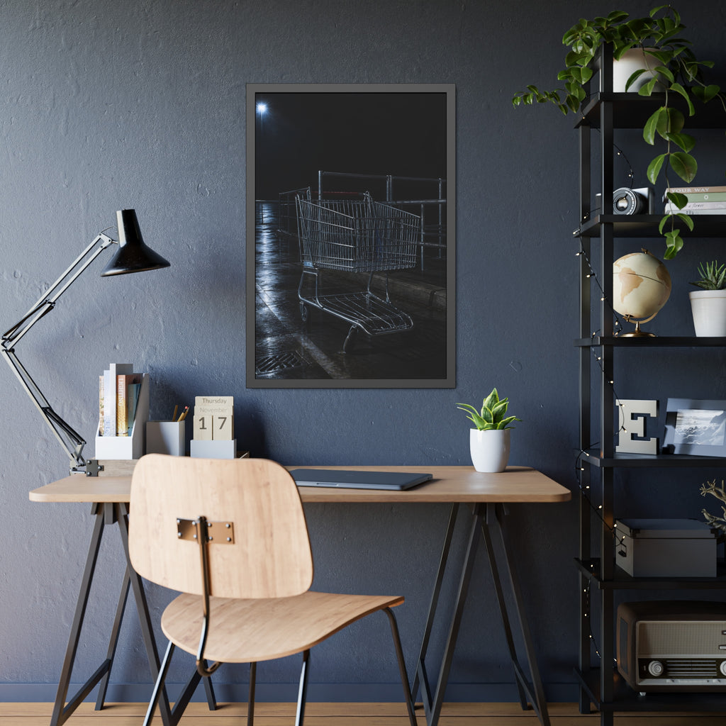 A shopping cart beside its corral on wet asphalt under a lot light. The Cart at the Corral by Garabaggio, framed fine art print hanging in a room.