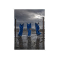 Three blue tarps hung from a wire over a wet lot under storm clouds. Banners After the Gale by Garabaggio, fine art print, 12″ x 16″.