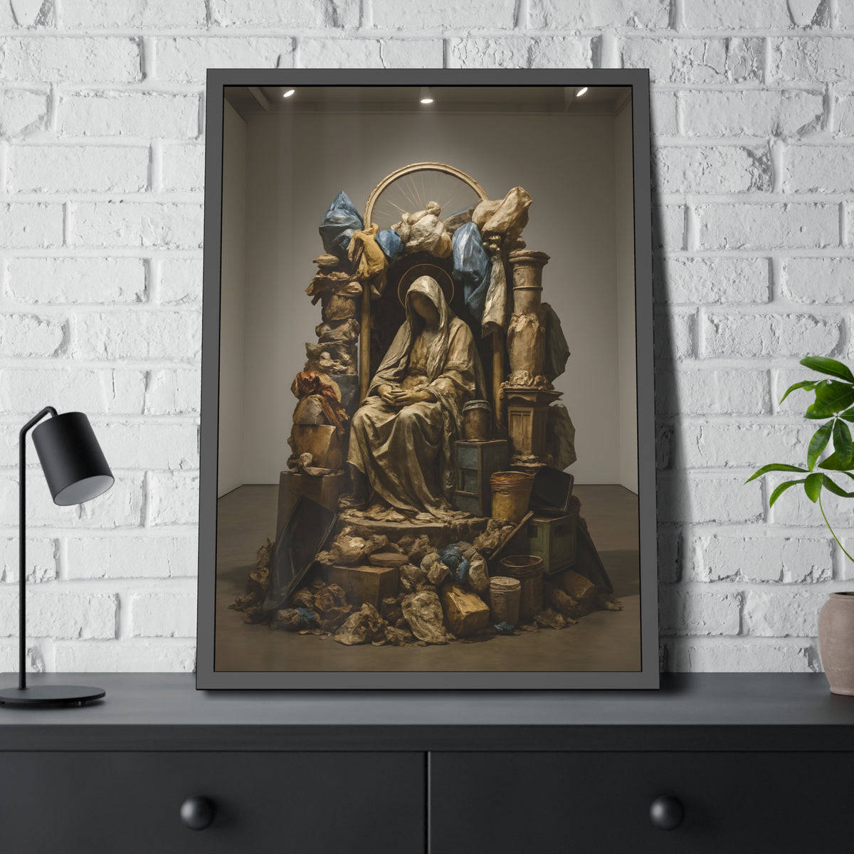 A veiled seated figure built from bags and refuse under a wheel halo. The Virgin Enthroned Among Ruins by Garabaggio, framed fine art print hanging in a room.