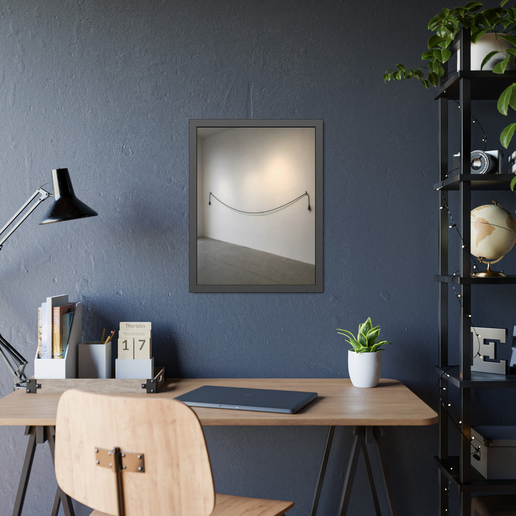 An extension cord hung in a long slack curve across a bare white wall. The Unplugged Line by Garabaggio, framed fine art print hanging in a room.