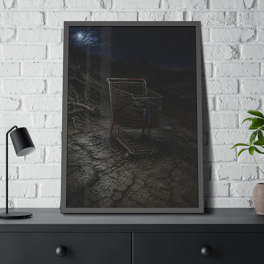 A rusted shopping cart sunk in cracked dried mud under a full moon. The Silting by Garabaggio, framed fine art print hanging in a room.