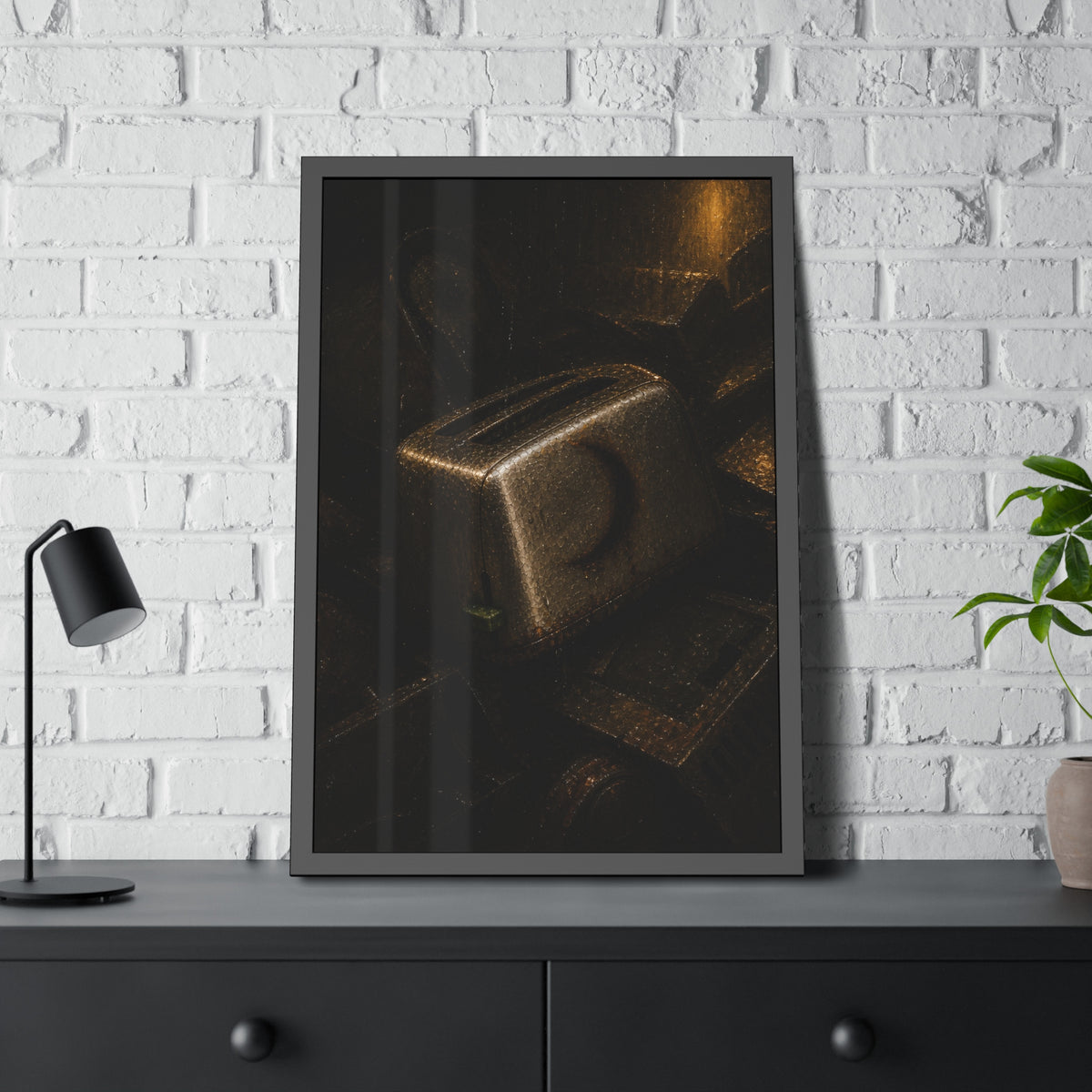 A scorched toaster resting on a heap of scrap appliances in dim light. The Arrival at Scrap by Garabaggio, framed fine art print hanging in a room.