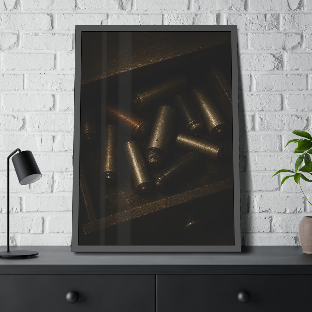 Old batteries loose in an open wooden drawer lit from above. The Drawer Congregation by Garabaggio, framed fine art print hanging in a room.