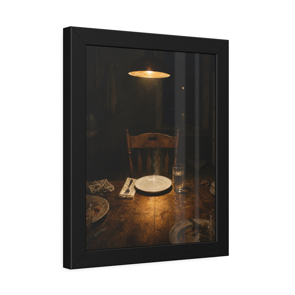 A clean plate and empty chair under a hanging lamp at a used dinner table. The Empty Seat at Dinner by Garabaggio, framed fine art print hanging in a room.
