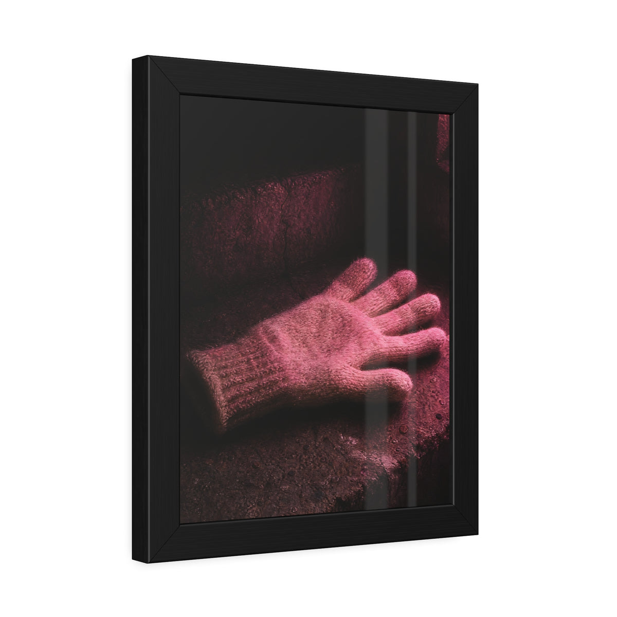 A knitted glove lying flat on a concrete step under pink light. The Vigil in Pink Light by Garabaggio, framed fine art print hanging in a room.