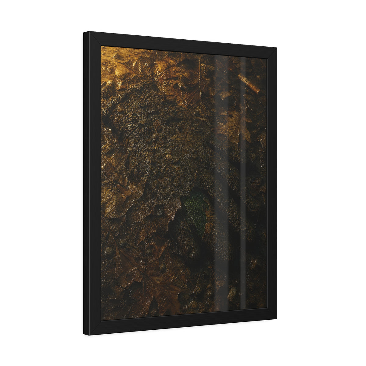 Wet mud and pressed oak leaves with a green scrap barely showing. The Reliquary of Mud and Leaf by Garabaggio, framed fine art print hanging in a room.