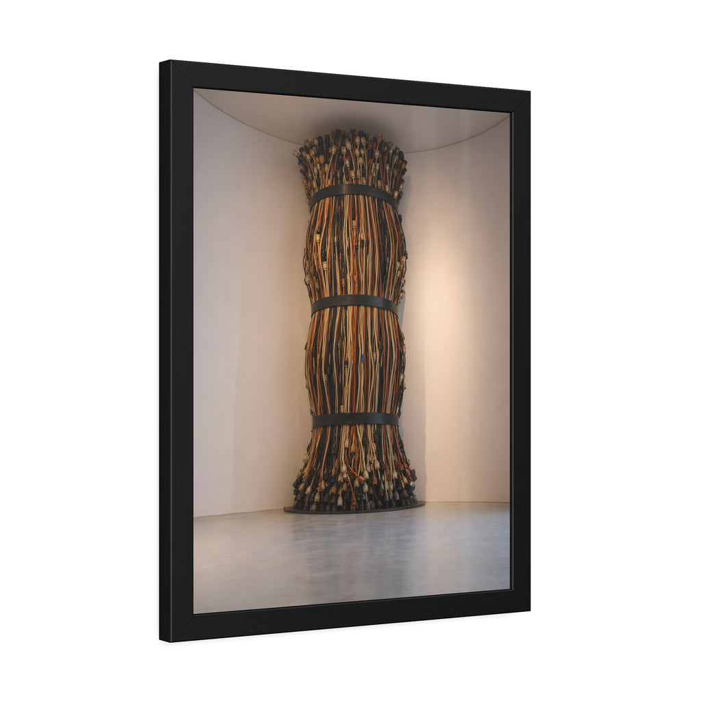 A tall column of bundled cords strapped in three places in a gallery corner. The Bundled Apse by Garabaggio, framed fine art print hanging in a room.