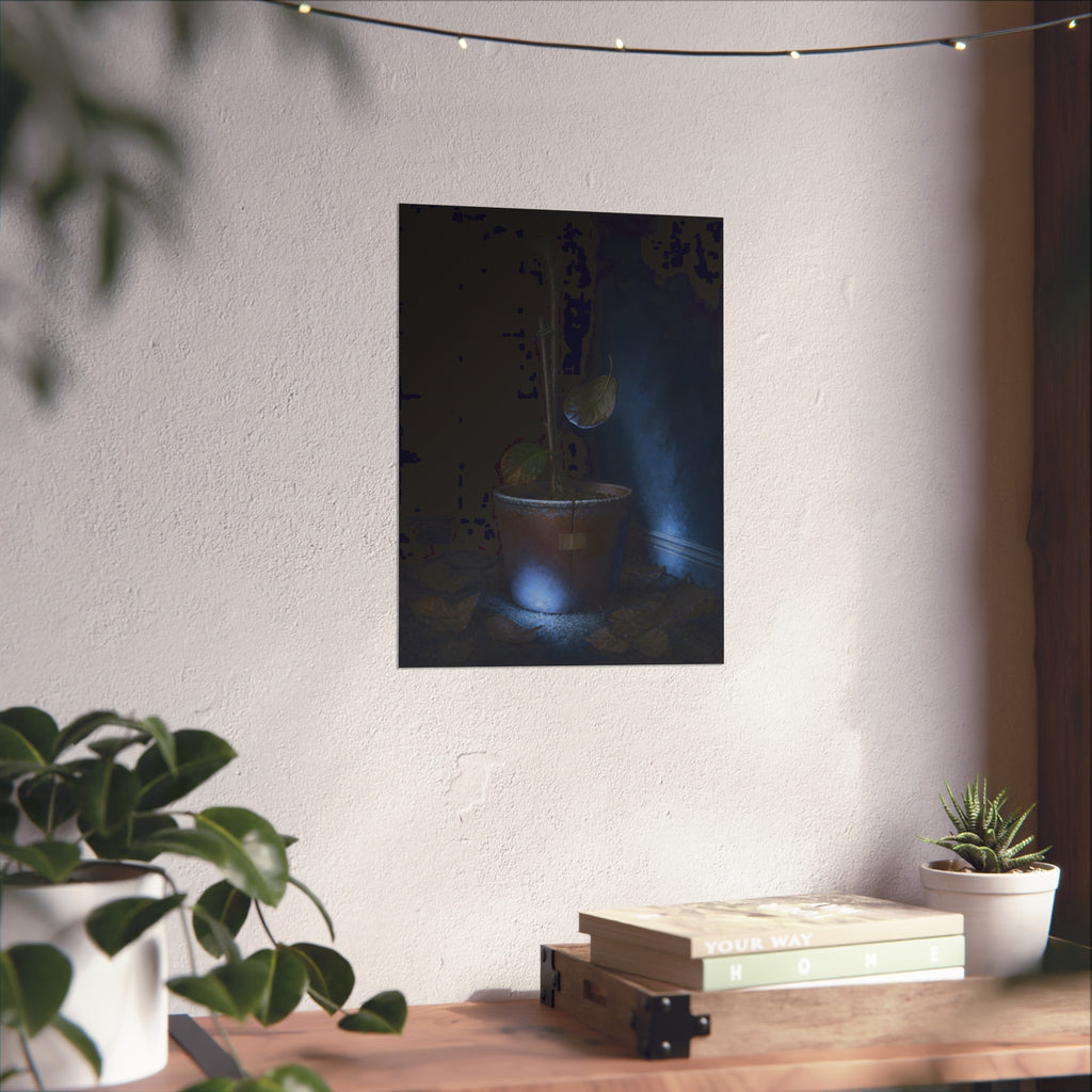 A bare potted plant dropping a leaf, dead leaves on the floor. The Leaf Lets Go by Garabaggio, fine art print hanging in a room.