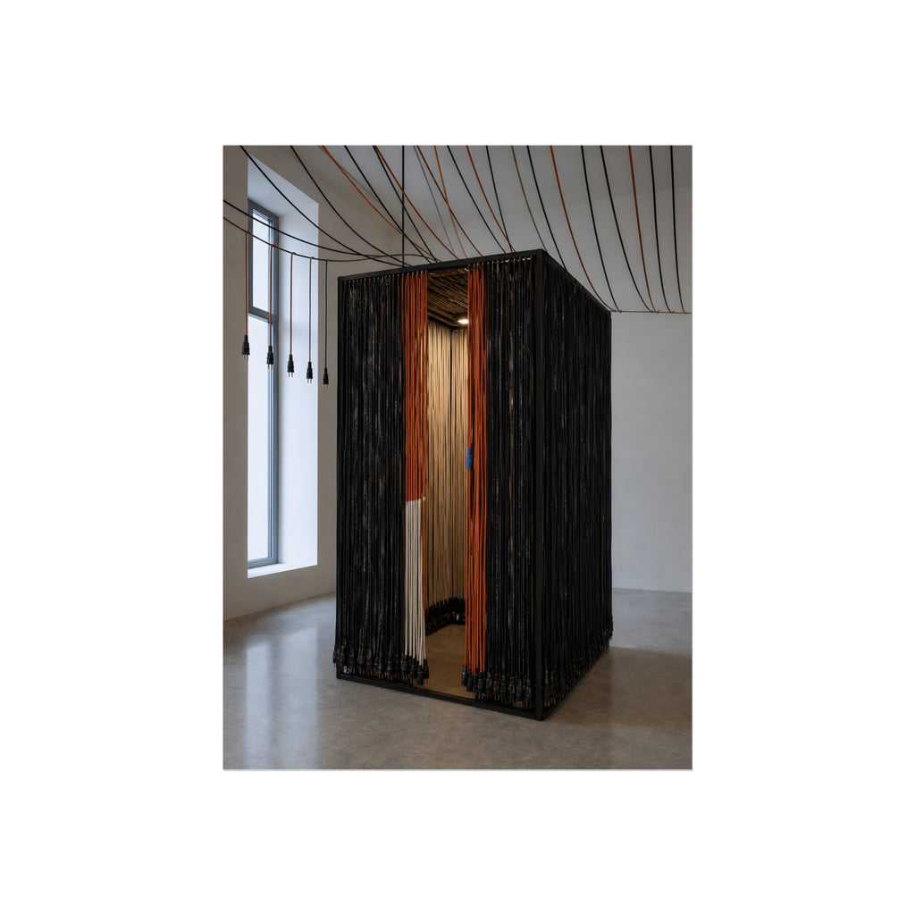 Booth walled with hanging power cords in a bare daylit room. Confessional for Current by Garabaggio, fine art print, 12″ x 16″.
