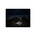 A sheet of paper on a grassy highway median beside a concrete post at night. The Resume on the Median by Garabaggio, fine art print, 16″ x 12″.