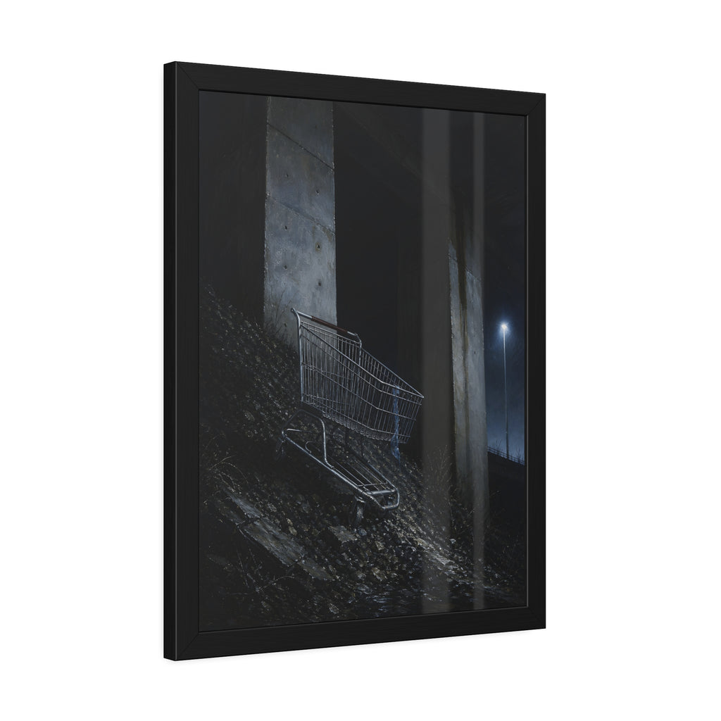 A shopping cart on a rocky slope under an overpass near a streetlamp. The Descent to the Underpass by Garabaggio, framed fine art print hanging in a room.