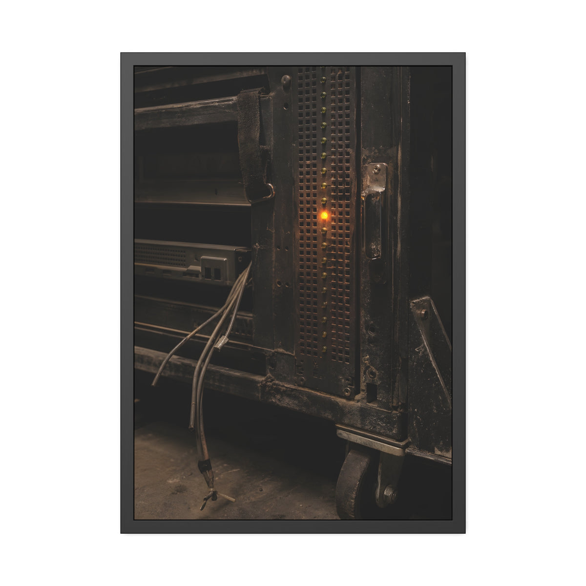 A single amber light among green LEDs on a grimy server rack. The Amber Fault by Garabaggio, framed fine art print, 28″ x 40″.