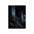 A shopping cart on a rocky slope under an overpass near a streetlamp. The Descent to the Underpass by Garabaggio, fine art print, 12″ x 16″.