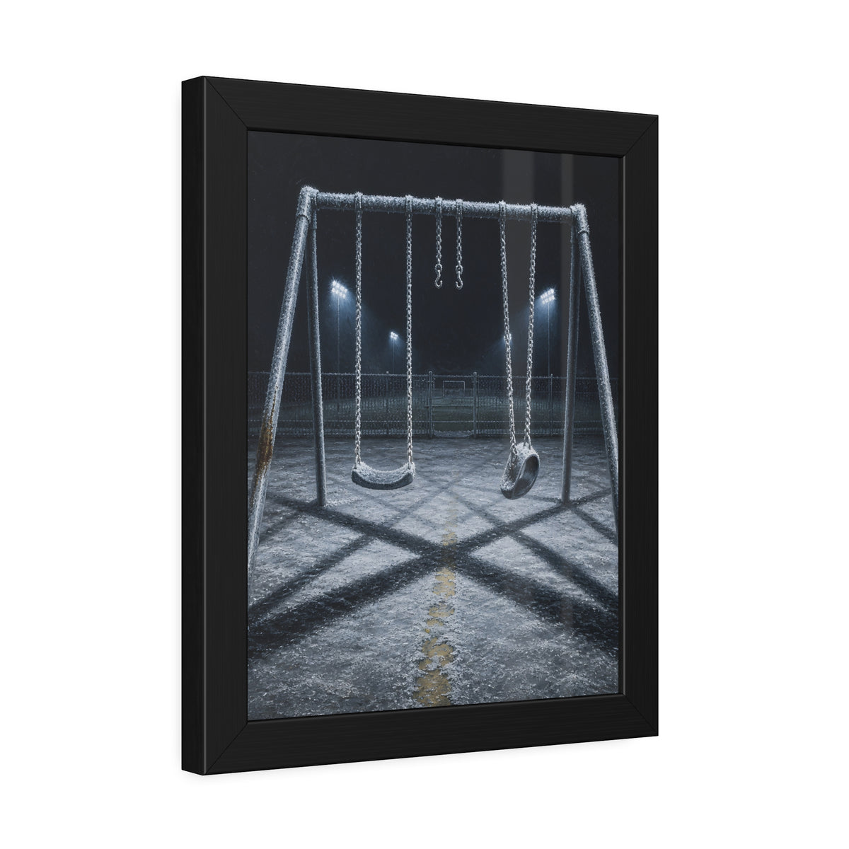 A frost covered swing set on empty asphalt under distant floodlights. The Third Hour: The Coldest Part by Garabaggio, framed fine art print hanging in a room.