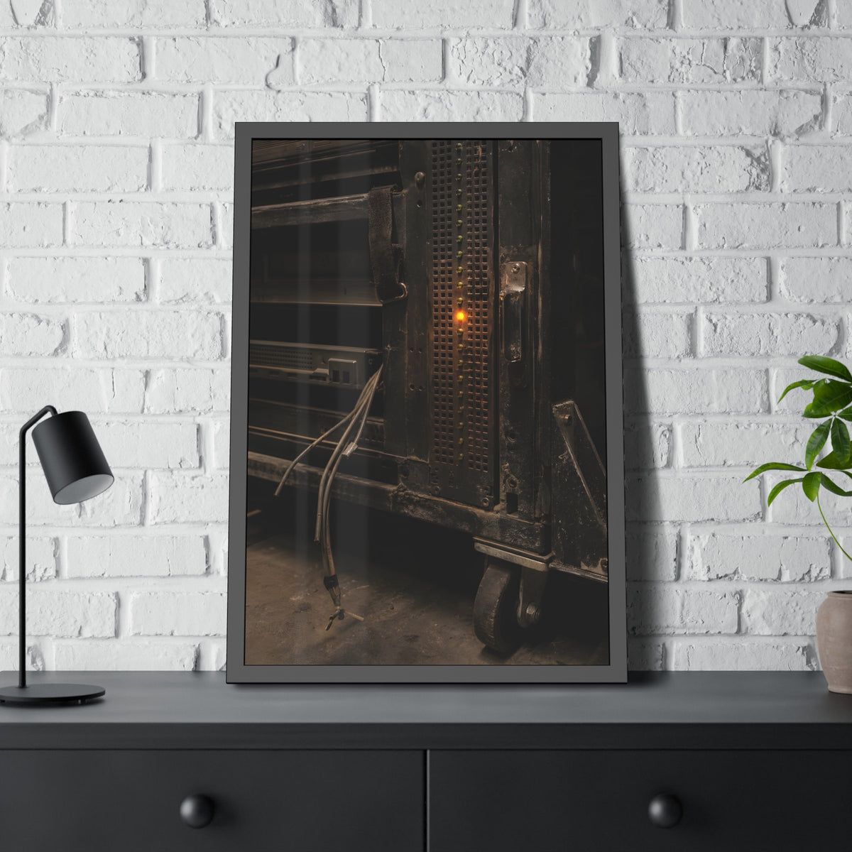 A single amber light among green LEDs on a grimy server rack. The Amber Fault by Garabaggio, framed fine art print hanging in a room.