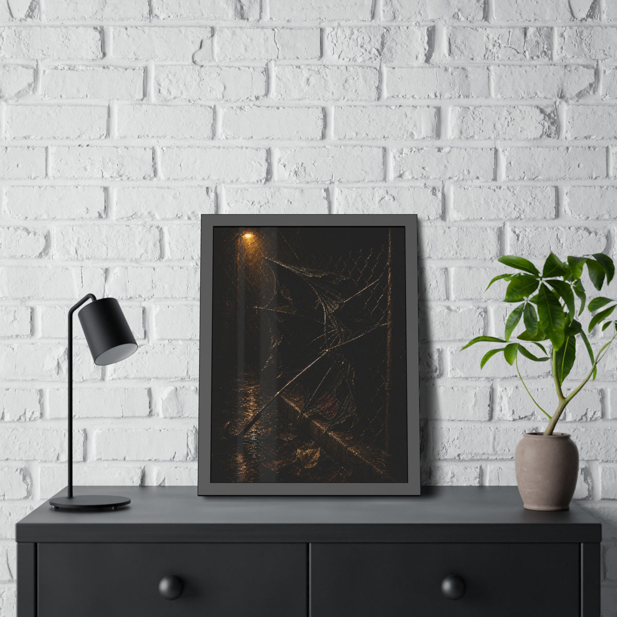 A broken umbrella pinned to a chain link fence under a rainy streetlamp. The Scourging by the Wind by Garabaggio, framed fine art print hanging in a room.