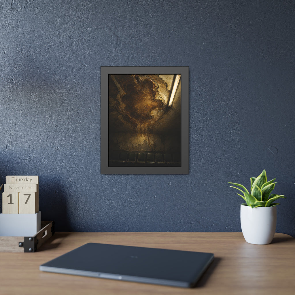 A brown water stain spreading across a ceiling above a row of chairs. The Stain Above the Row by Garabaggio, framed fine art print hanging in a room.