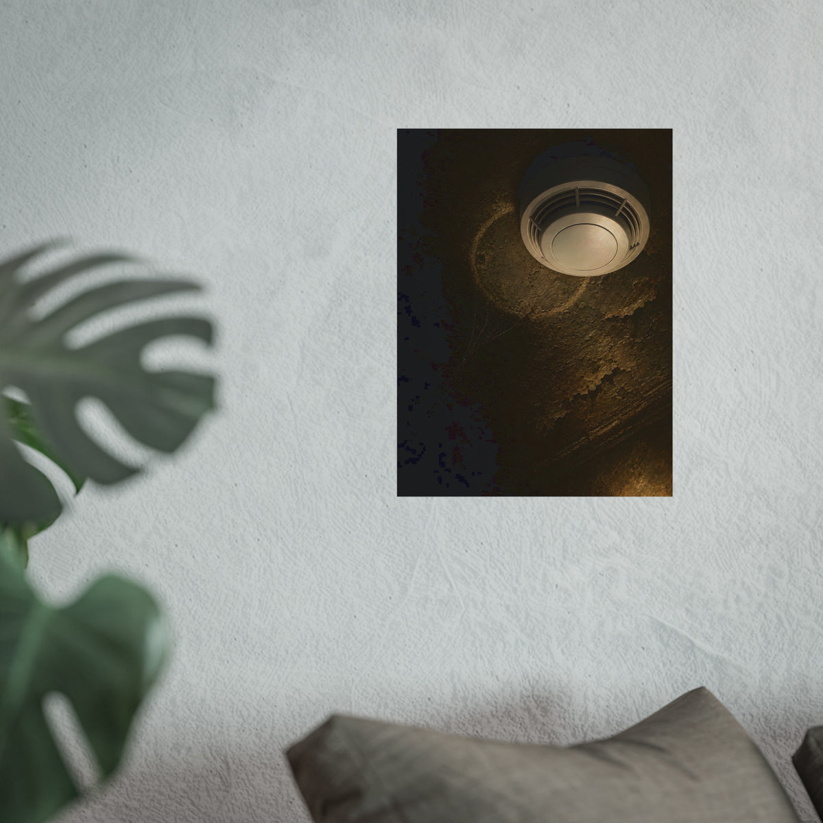A new smoke detector on a stained ceiling next to an old mounting ring. The New Detector by Garabaggio, fine art print hanging in a room.