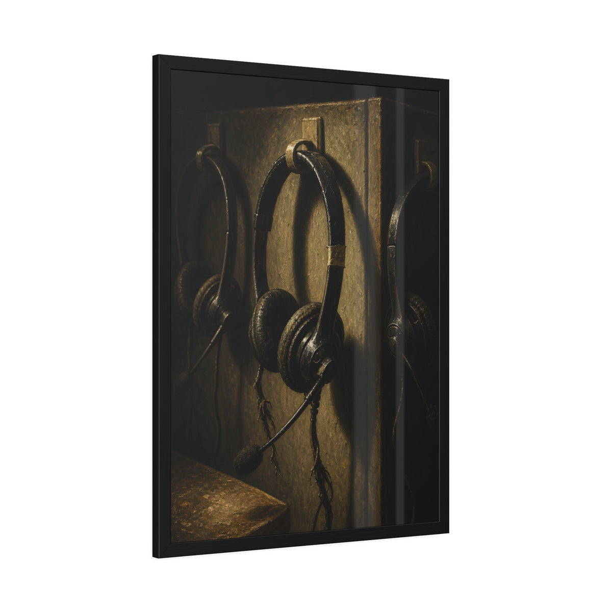 Three worn call center headsets hanging on wall hooks in dim light. The Headsets Left Hanging by Garabaggio, framed fine art print hanging in a room.