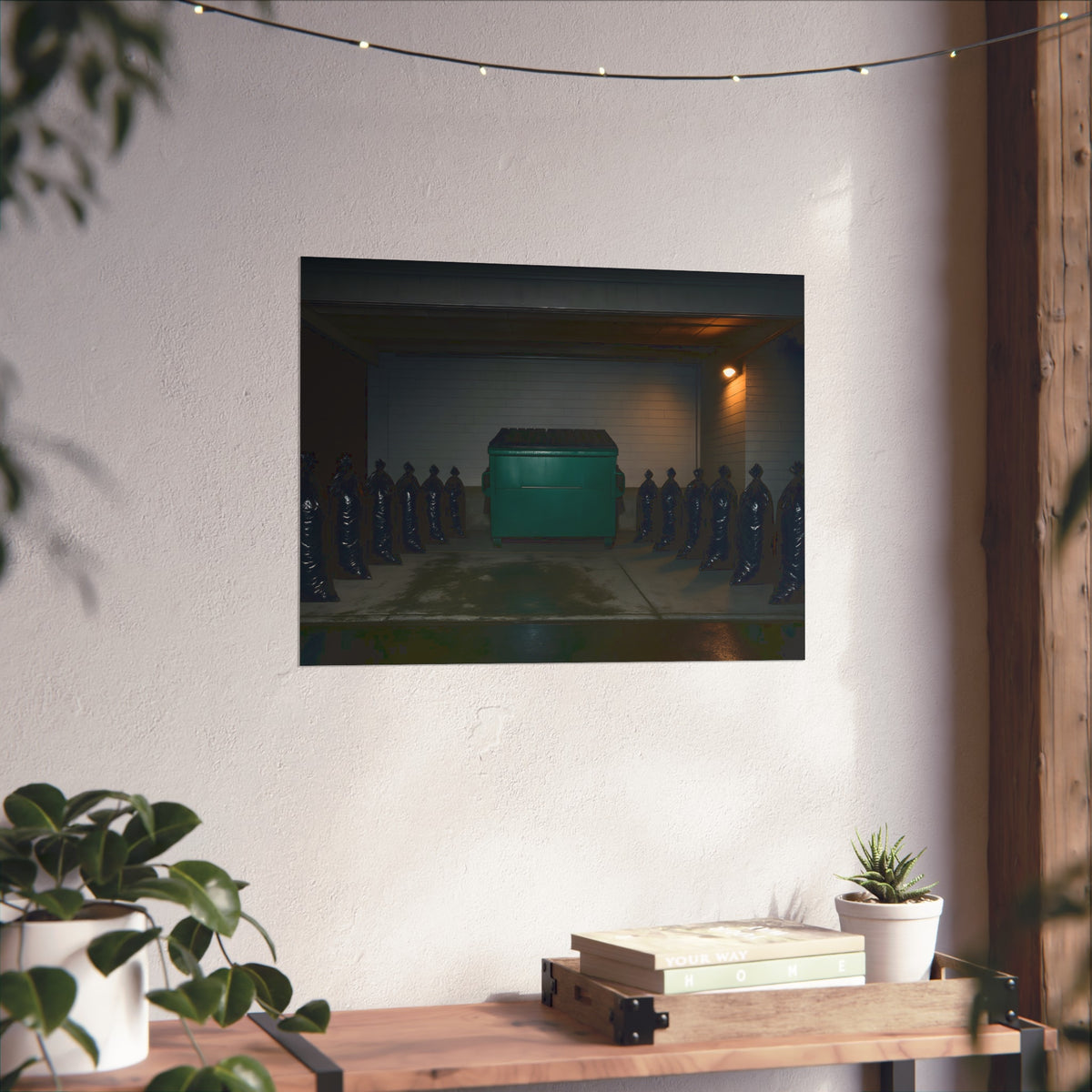 A green dumpster flanked by rows of black garbage bags under a lamp. Night Watch of the Loading Dock by Garabaggio, fine art print hanging in a room.