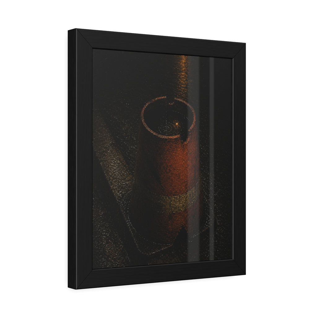 An upturned traffic cone holding rainwater at a wet curb under a lamp. The Cup of Rain by Garabaggio, framed fine art print hanging in a room.