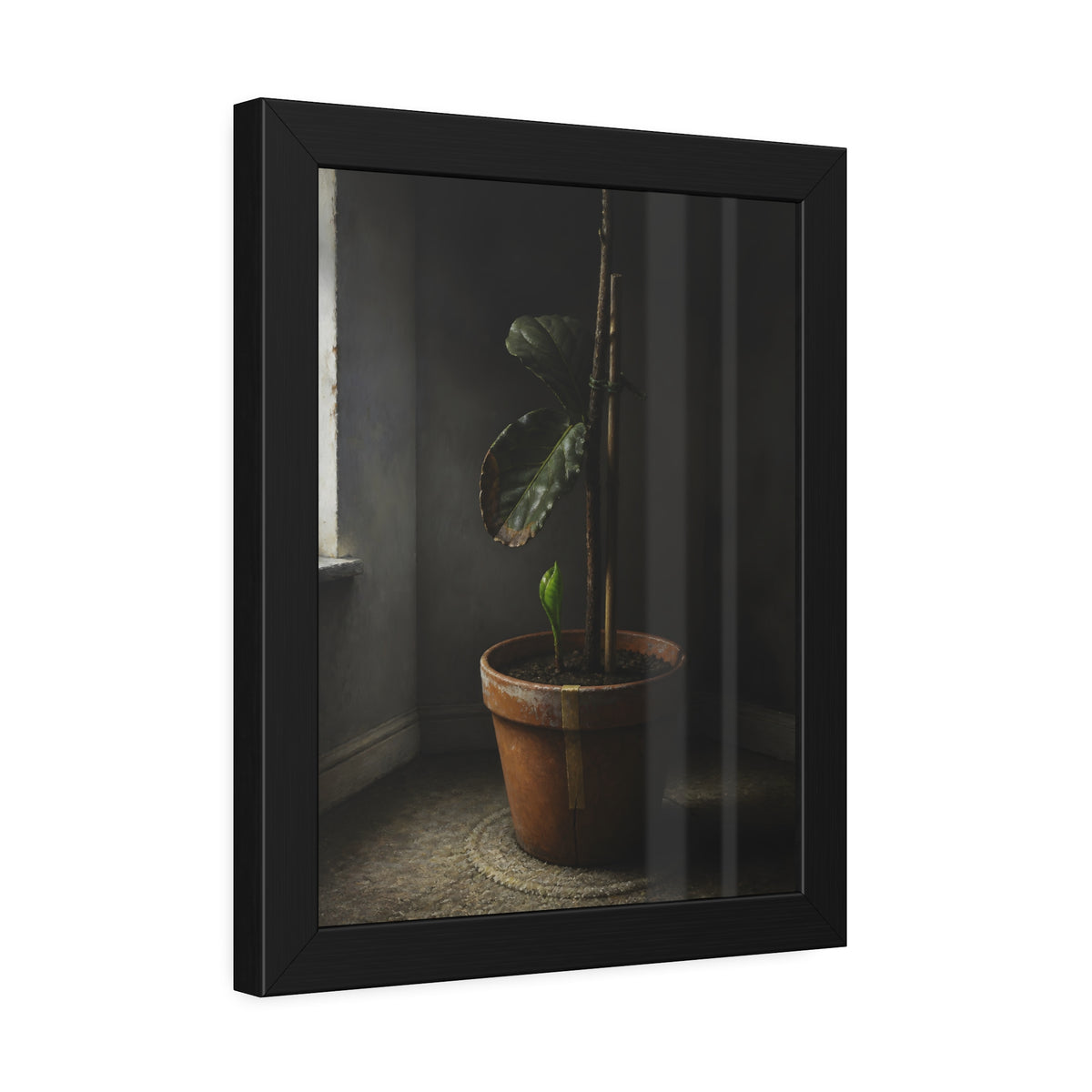A potted plant down to two curled leaves and one new sprout by a window. The Corner by the Window Again by Garabaggio, framed fine art print hanging in a room.
