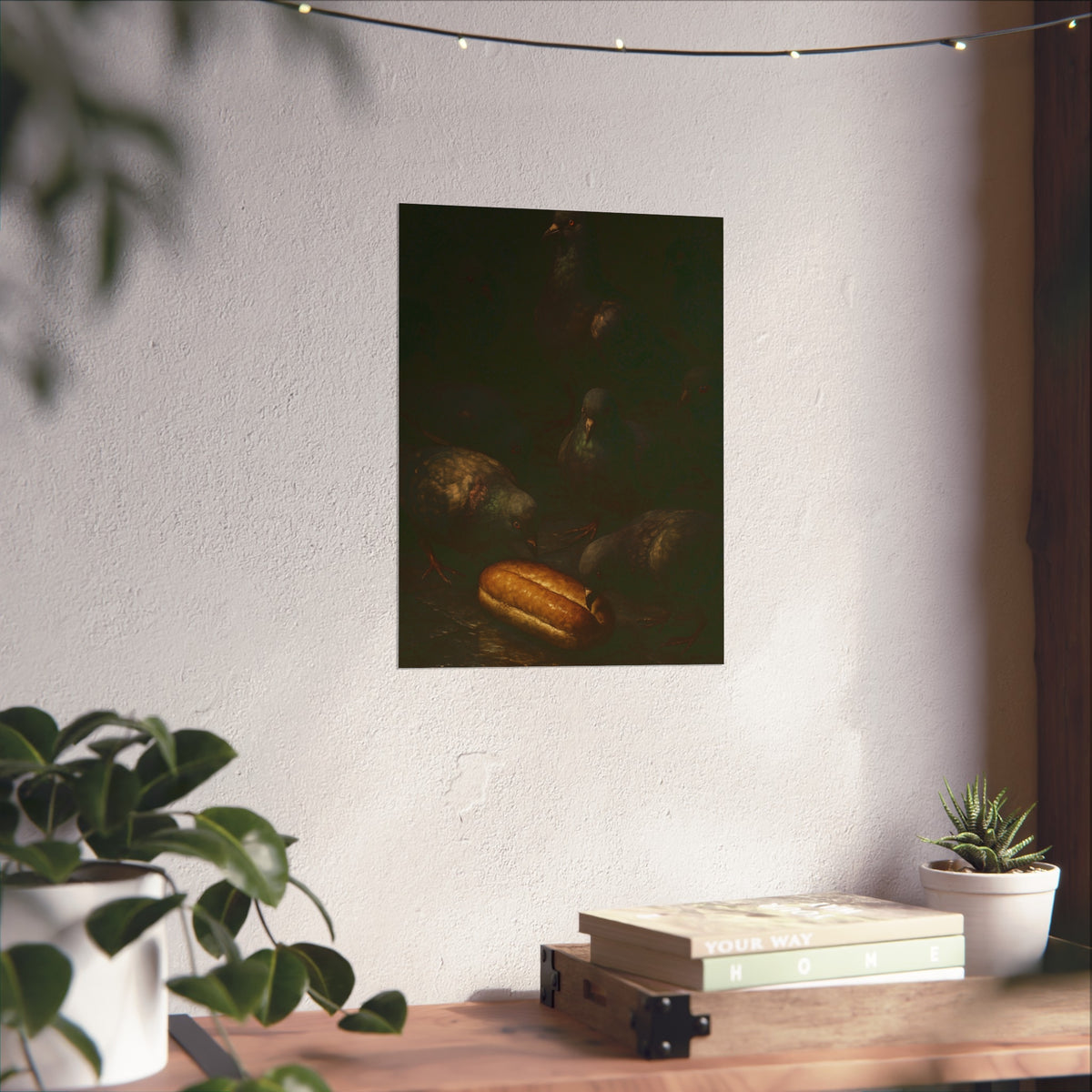 Pigeons crowding around a bread roll on dark stone paving. The Congregation at the Bun by Garabaggio, fine art print hanging in a room.