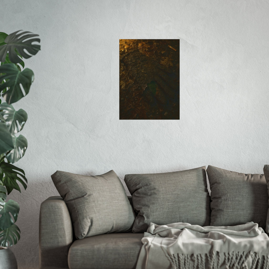 Wet mud and pressed oak leaves with a green scrap barely showing. The Reliquary of Mud and Leaf by Garabaggio, fine art print hanging in a room.