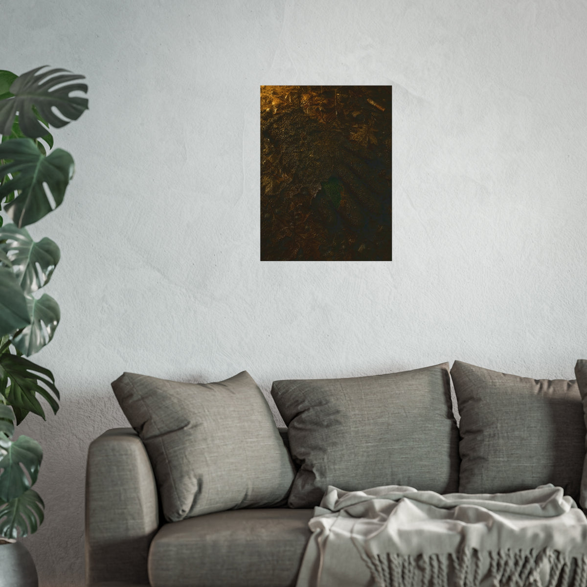 Wet mud and pressed oak leaves with a green scrap barely showing. The Reliquary of Mud and Leaf by Garabaggio, fine art print hanging in a room.