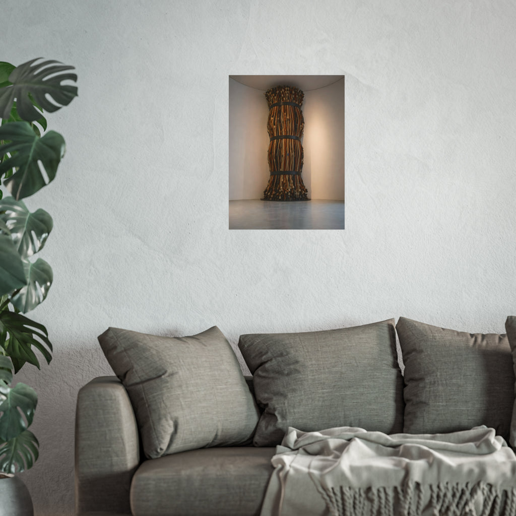 A tall column of bundled cords strapped in three places in a gallery corner. The Bundled Apse by Garabaggio, fine art print hanging in a room.