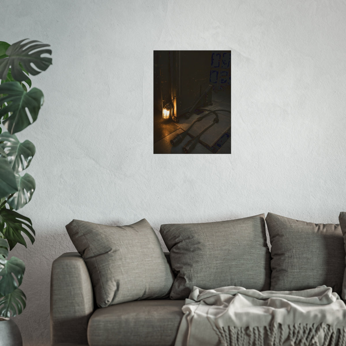Two thick power cables unplugged on the floor beside a caged work lamp. The Redundant Power by Garabaggio, fine art print hanging in a room.