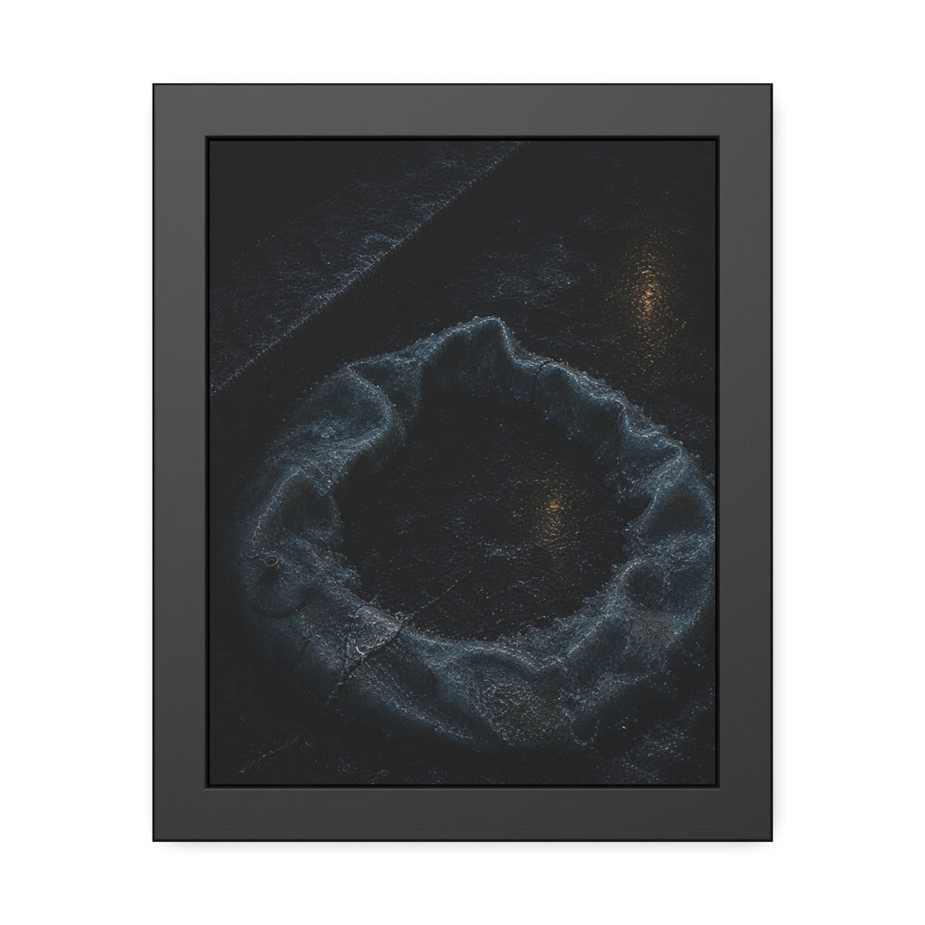 A deflated ring float collapsed on wet pavement under distant amber light. The Freezing of the Smile by Garabaggio, framed fine art print, 11″ x 14″.