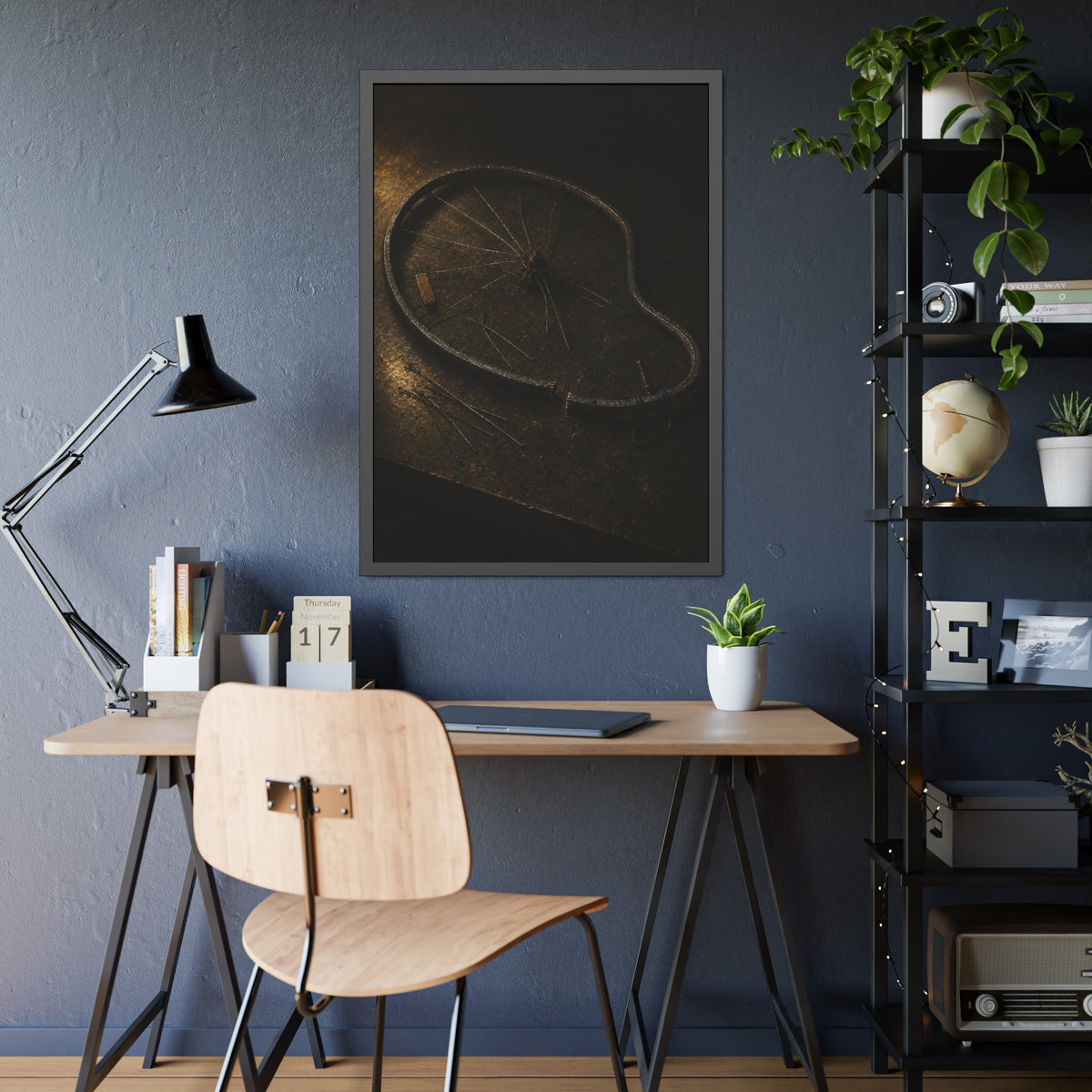 A bent bicycle wheel rim with loose spokes on a dark table in warm light. The Cutting of the Circle by Garabaggio, framed fine art print hanging in a room.