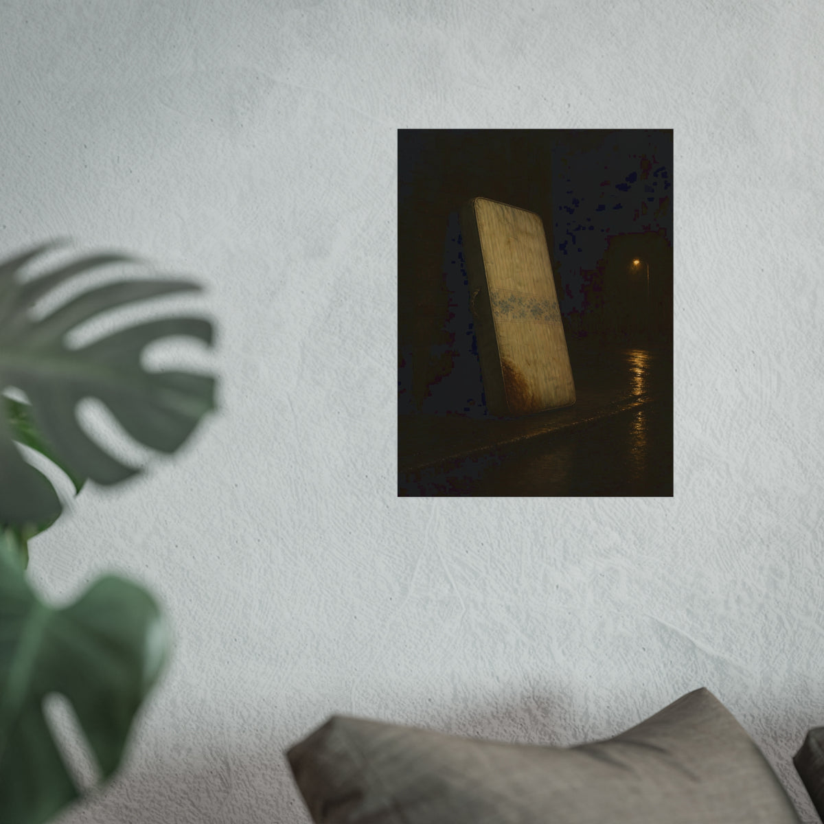 A stained mattress propped on a brick wall along a wet night street. The Presentation Against the Brick by Garabaggio, fine art print hanging in a room.