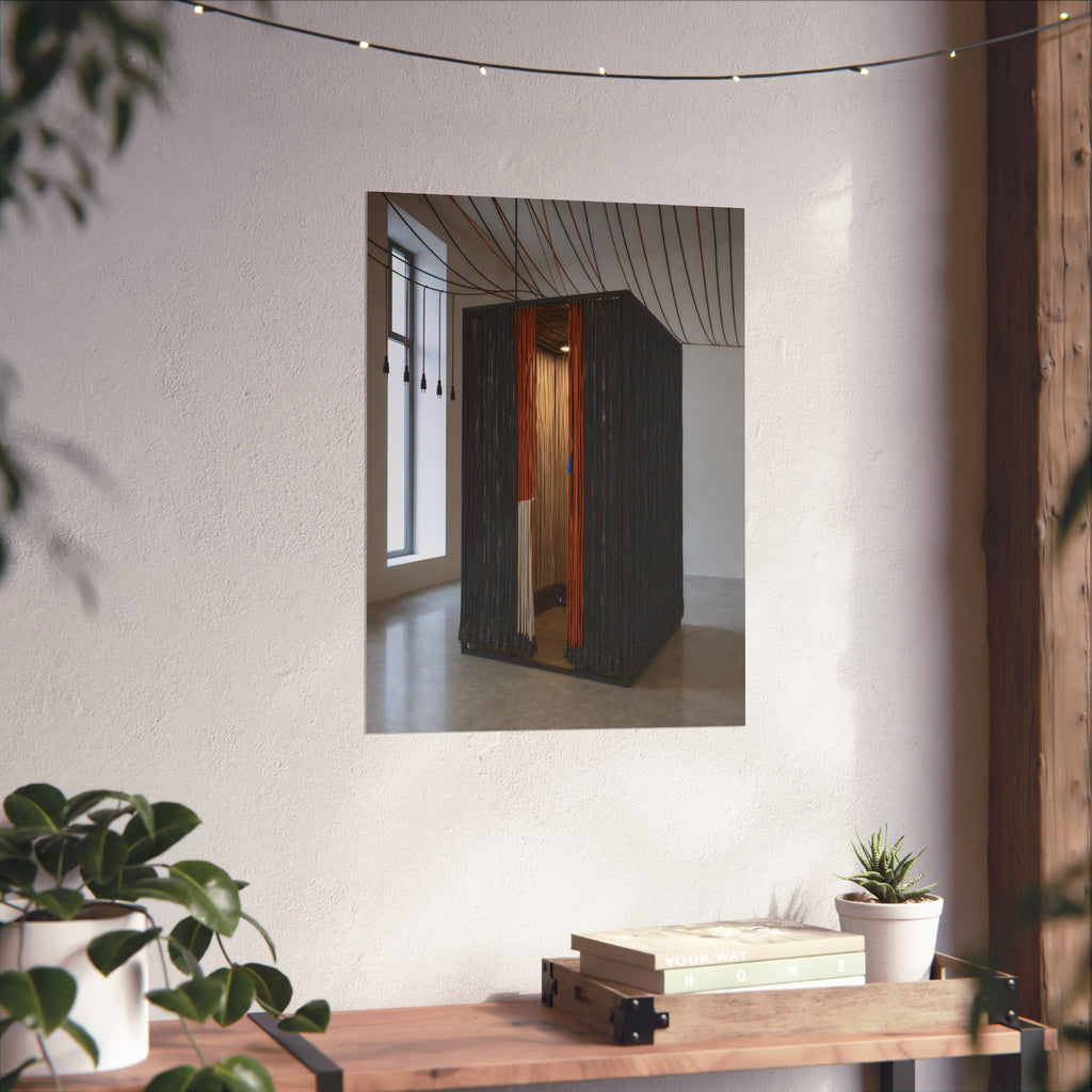 Booth walled with hanging power cords in a bare daylit room. Confessional for Current by Garabaggio, fine art print hanging in a room.