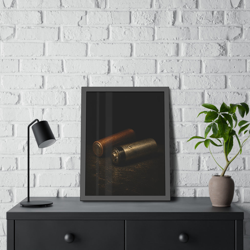 Two spent batteries lying side by side, one rusted, one bare metal. The Second Voice by Garabaggio, framed fine art print hanging in a room.