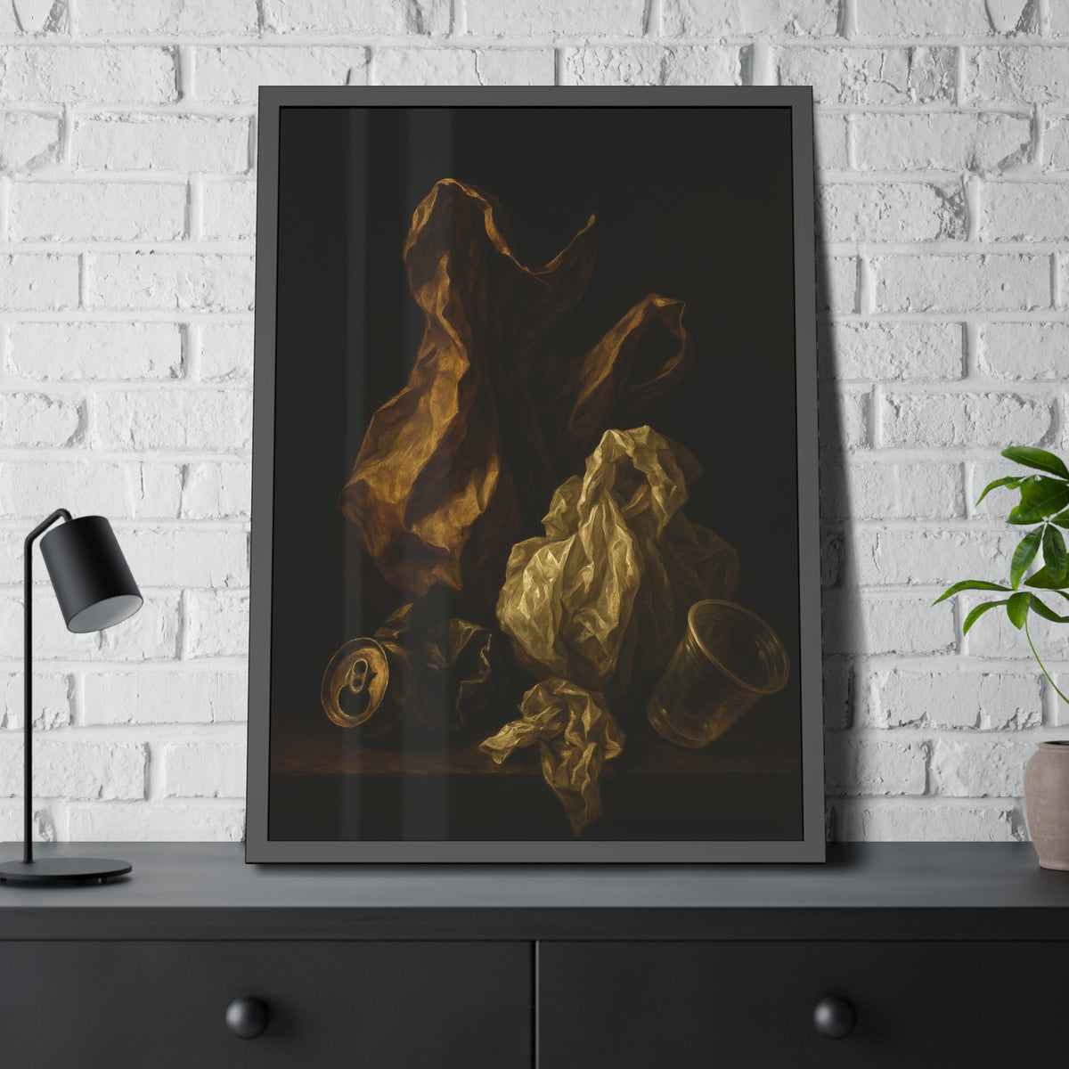 A plastic bag and crumpled paper beside a crushed can and clear cup. The Two Penitents by Garabaggio, framed fine art print hanging in a room.
