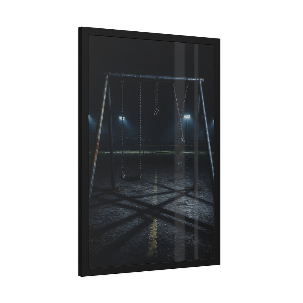 An empty swing set at night with field lights glowing behind it. The Ninth Hour: The Seat Still Moving by Garabaggio, framed fine art print hanging in a room.